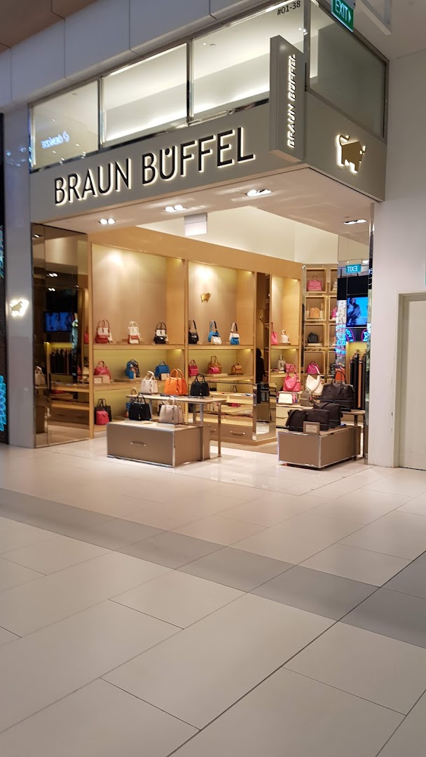 The Braun Büffel shop front displays a wide array of stylish leather handbags and accessories.