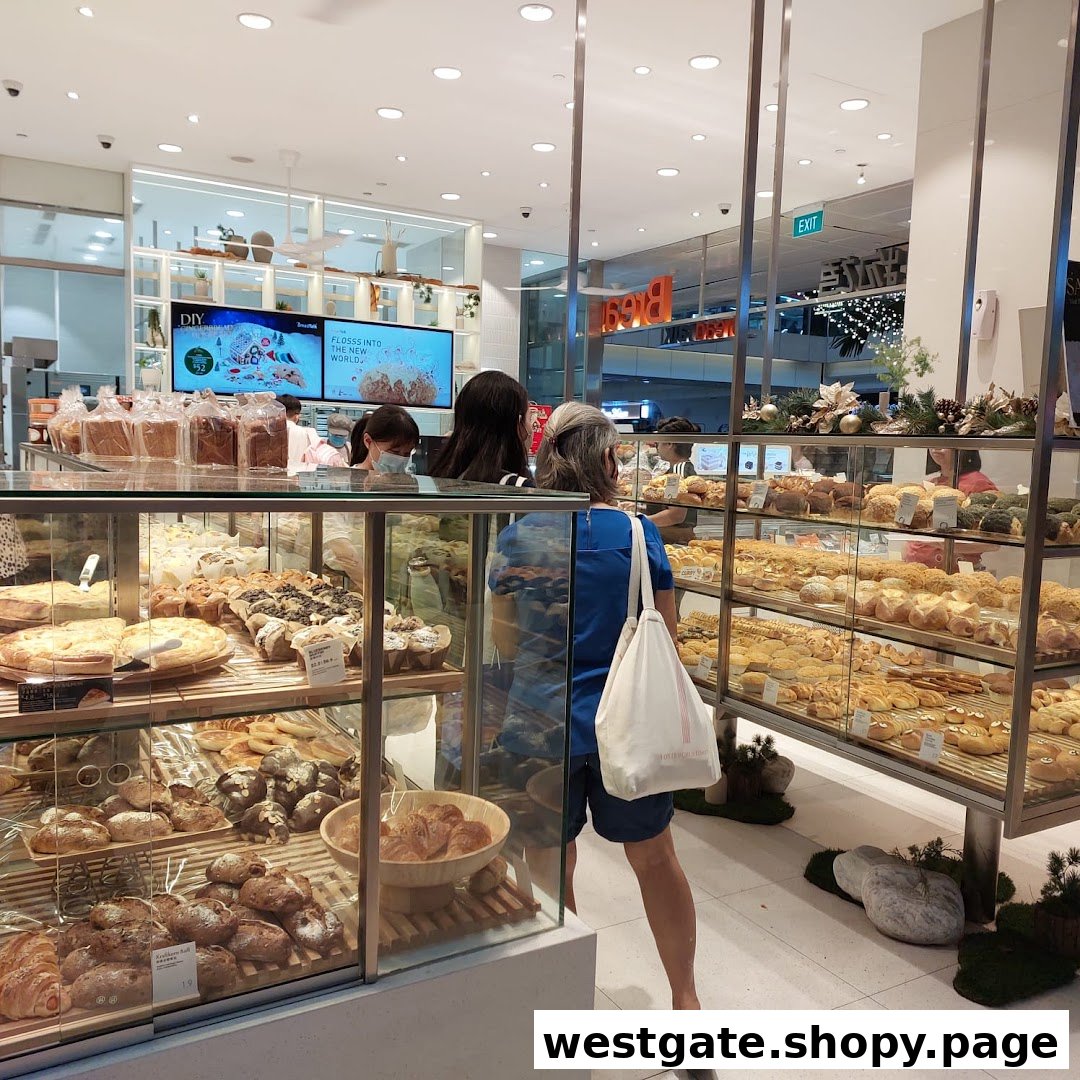 Customers browse a wide selection of freshly baked breads and pastries inside BreadTalk Westgate.