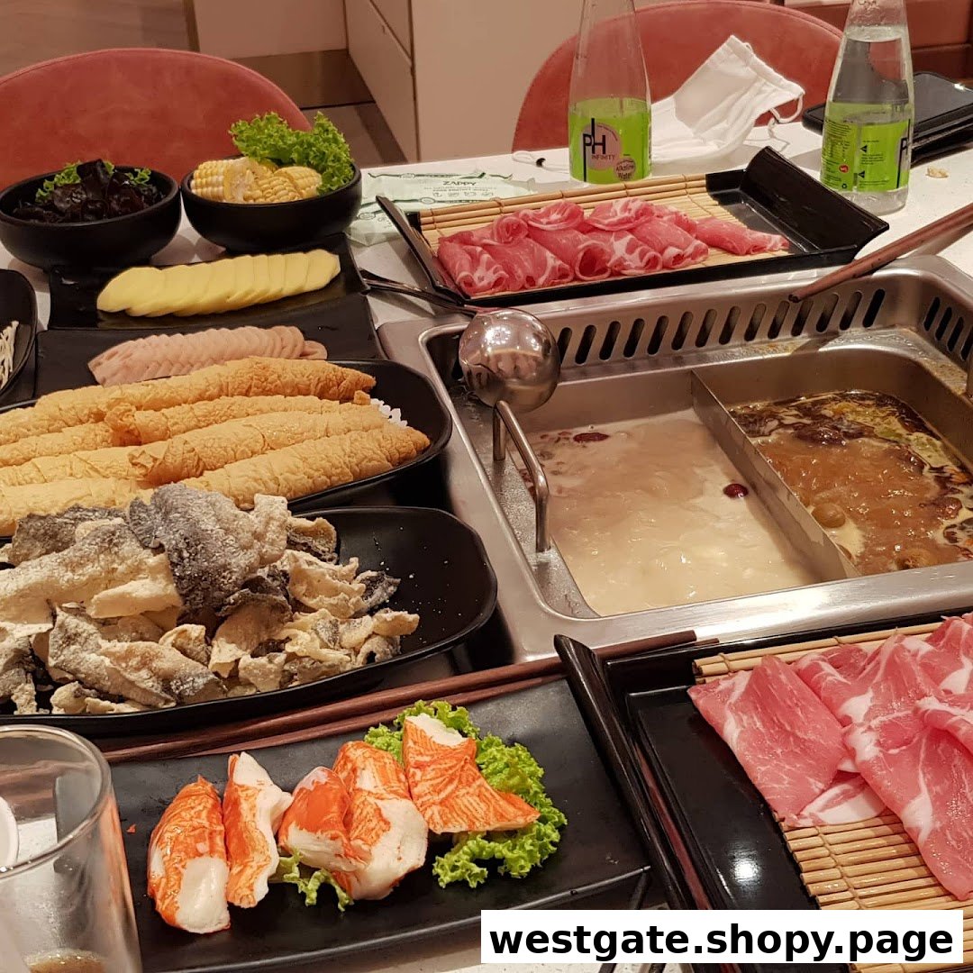 A vibrant hotpot spread featuring various fresh ingredients and two simmering broths.