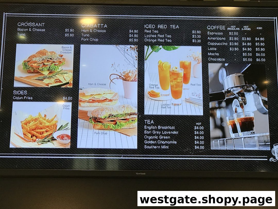 A digital menu board displaying various croissants, ciabattas, sides, coffees, and teas with prices.