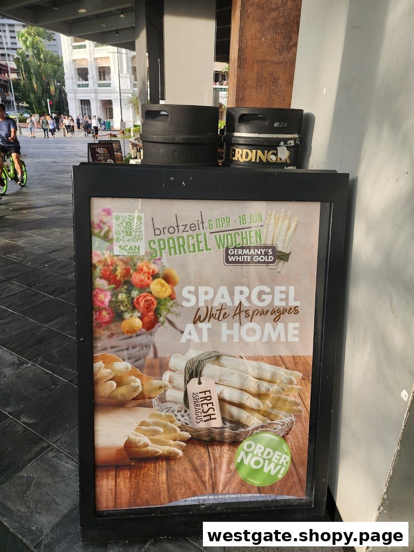 An A-frame sign outside Brotzeit German Beer Bar and Restaurant advertising 'Spargel Wochen' (Asparagus Weeks).