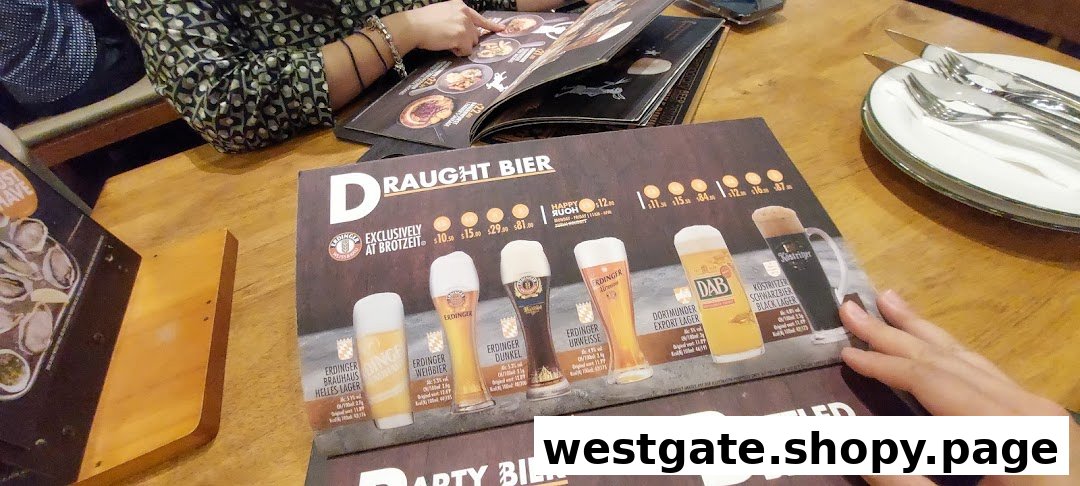 A close-up of a menu displaying various draught beers and their prices at Brotzeit German Beer Bar.