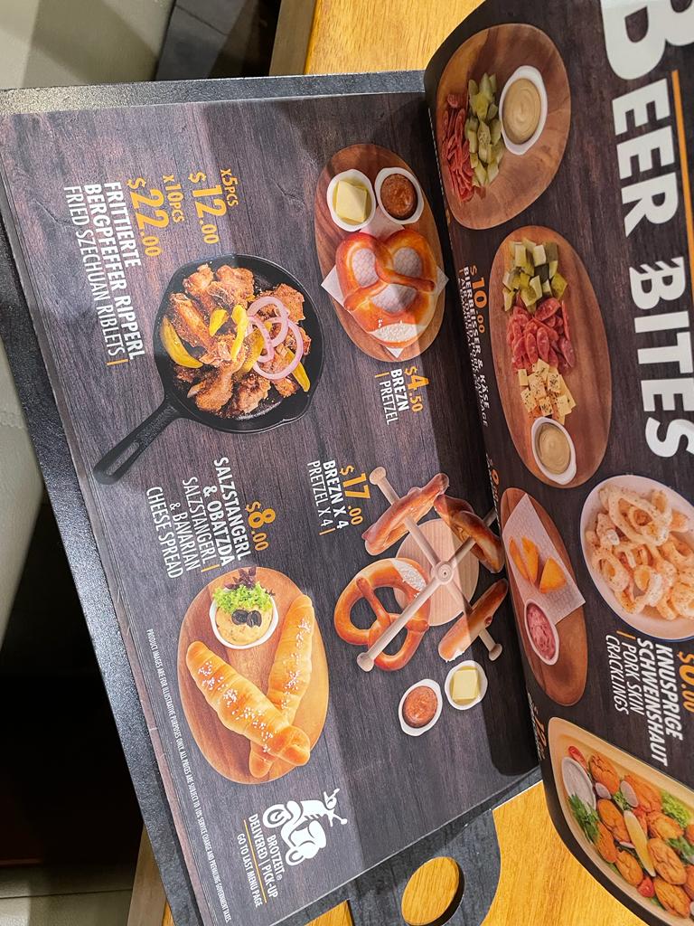 A menu page from Brotzeit German Beer Bar and Restaurant, showcasing a selection of 'Beer Bites' with prices and images.