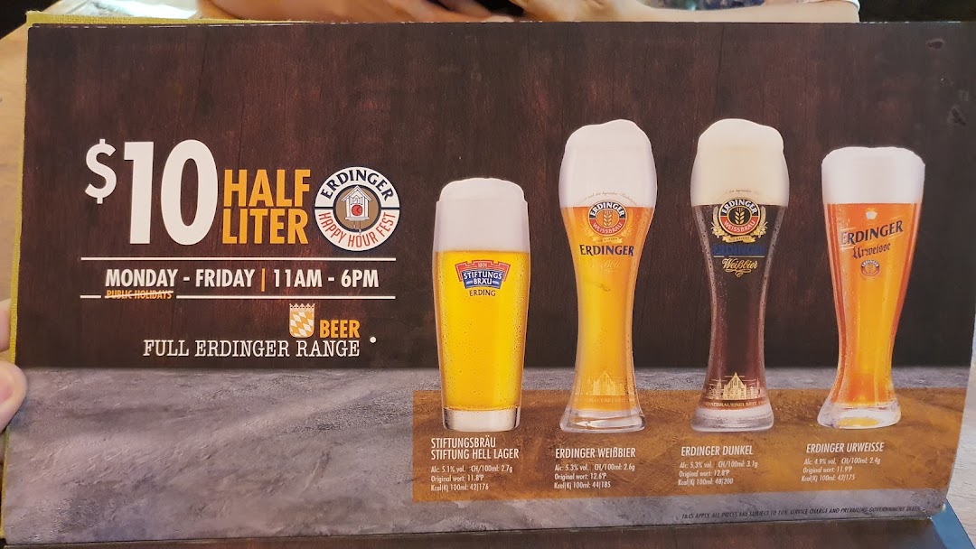 A menu board displaying a happy hour offer for Erdinger beers at $10 per half liter.