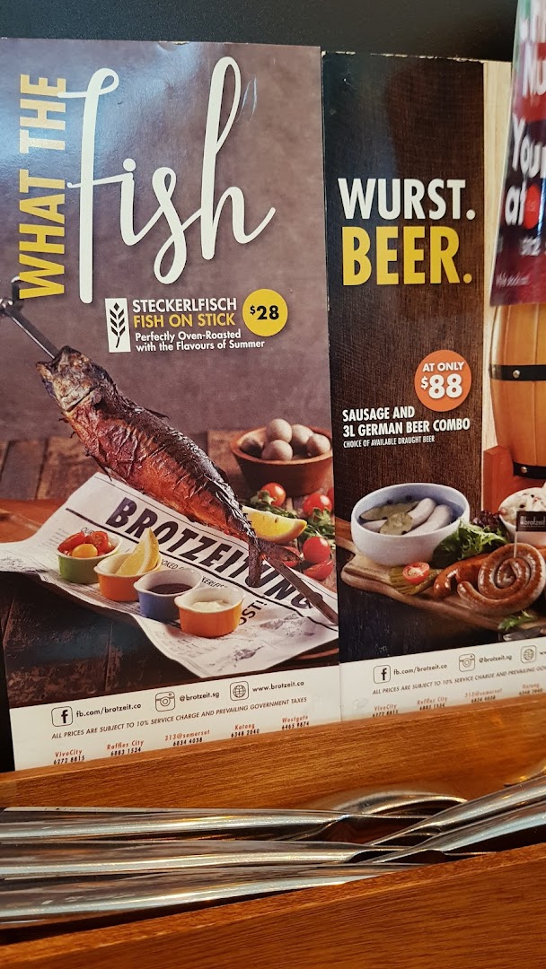 A menu displaying a German fish dish and a sausage and beer combo deal with prices.