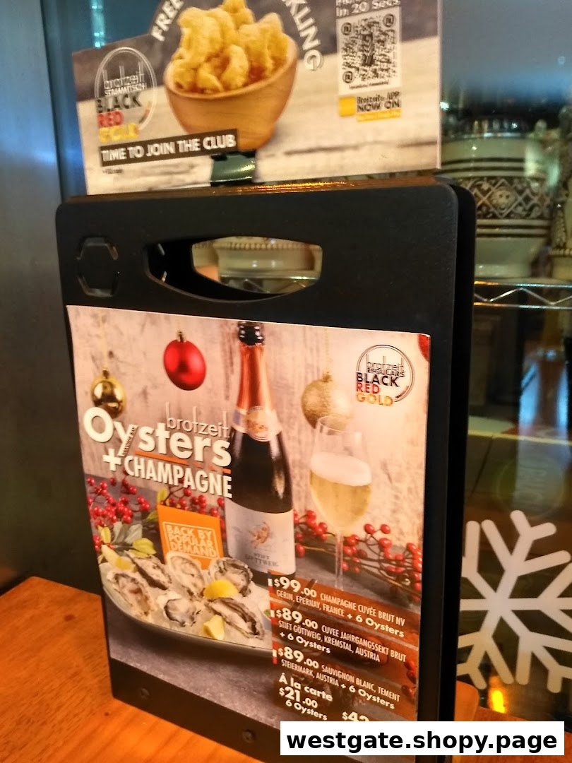 A table stand displaying Brotzeit's Oysters + Champagne promotion with prices and club membership details.