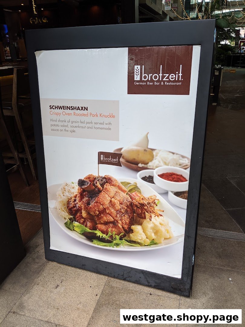 A display board showcasing Brotzeit's signature Crispy Oven Roasted Pork Knuckle (Schweinshaxn).