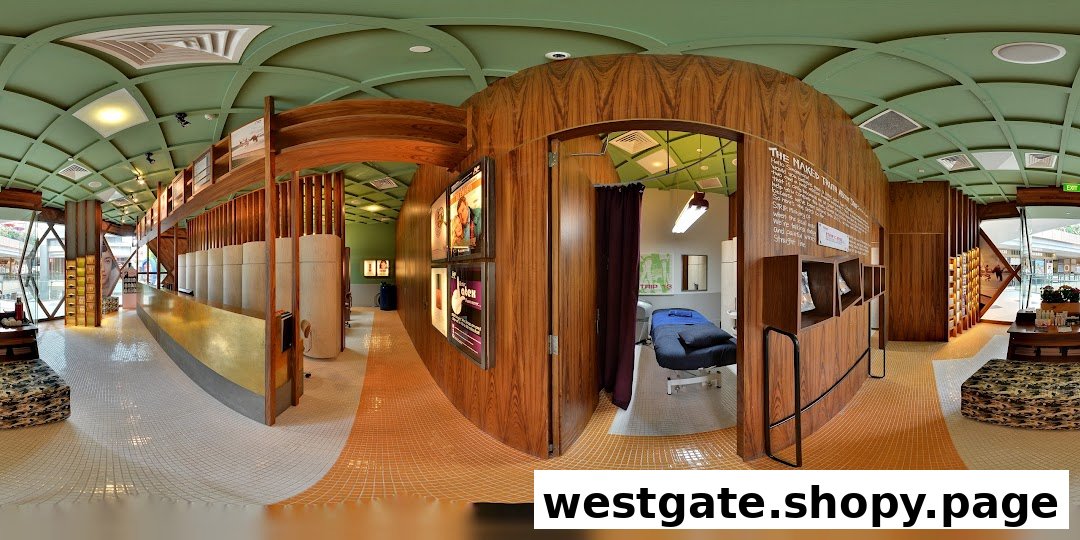 A panoramic view of Browhaus Westgate's modern interior, featuring a reception area, product displays, and a treatment room.