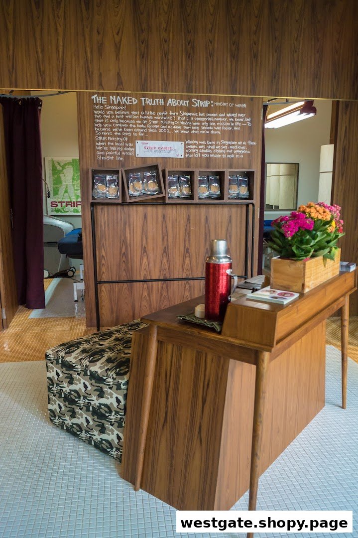 Interior view of a waxing salon reception area featuring a wooden display, desk, and seating.