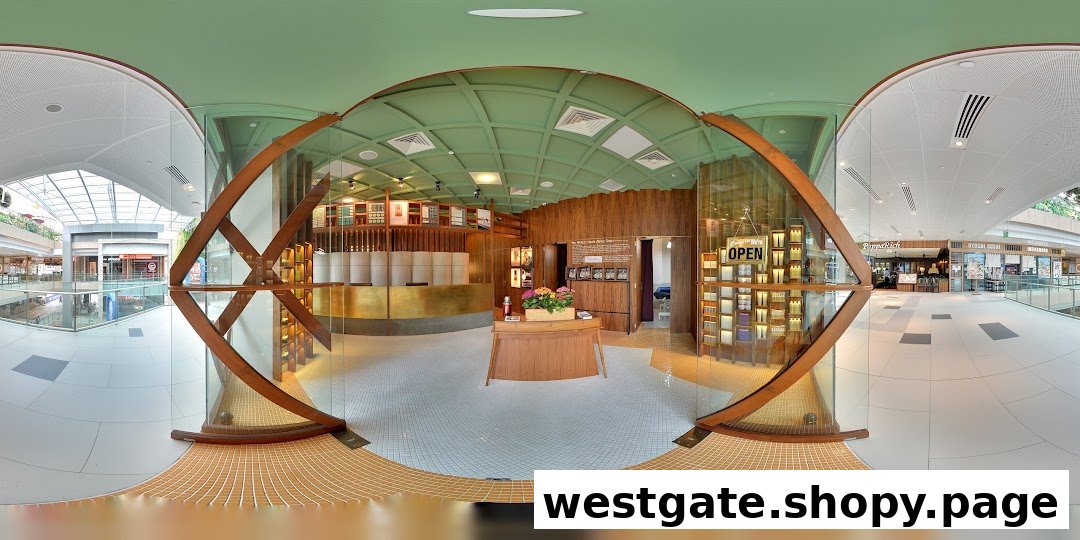 A panoramic view of Browhaus Westgate's unique curved shop entrance and interior from the mall walkway.
