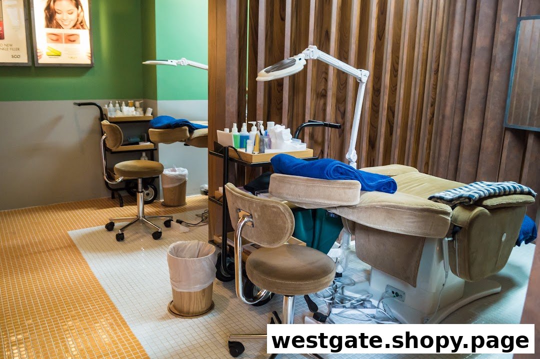 A clean and inviting beauty treatment room with a comfortable chair, adjustable bed, and professional equipment.