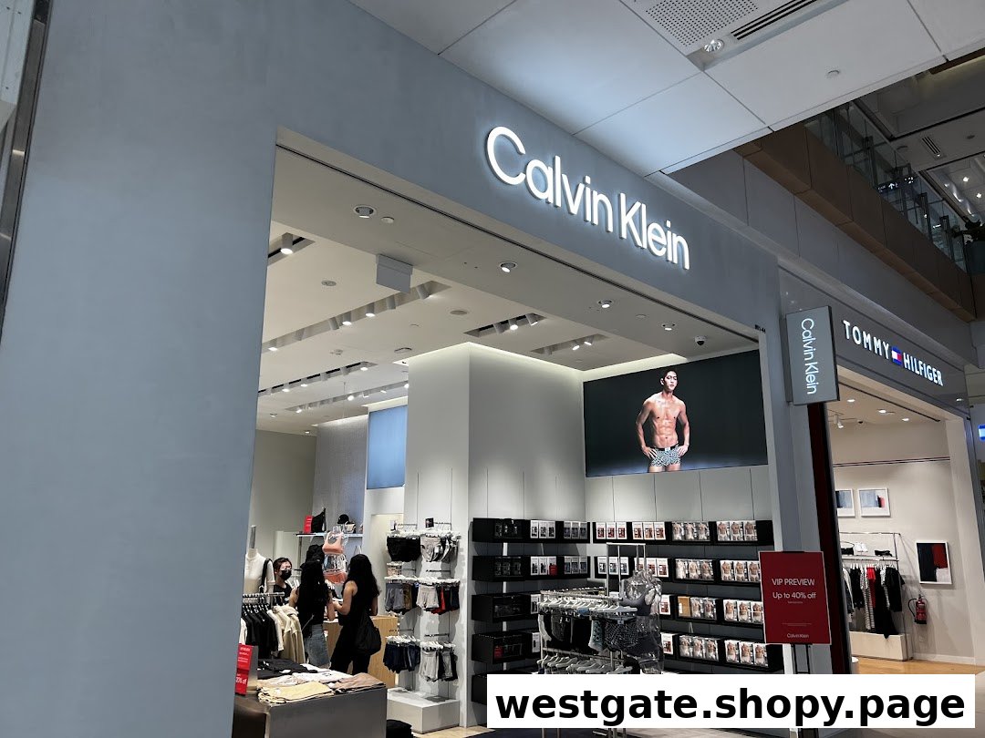 The Calvin Klein storefront showcases modern apparel, underwear, and accessories, featuring a large digital display and inviting interior.