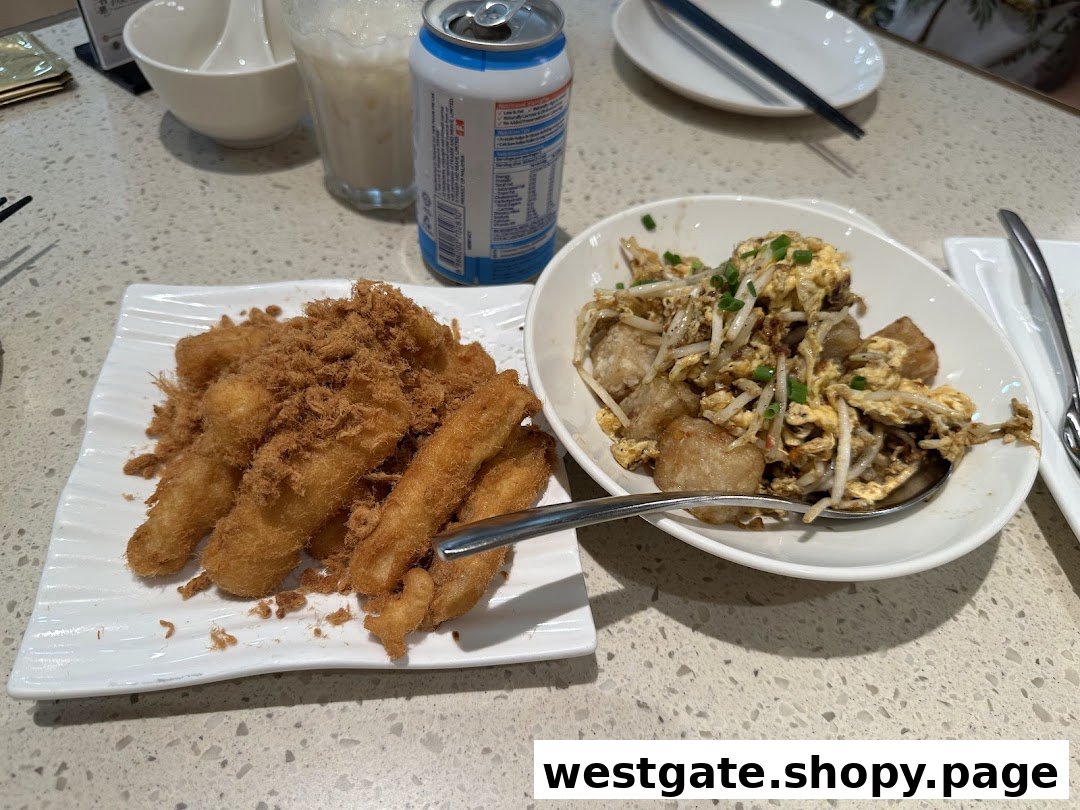Two delicious dishes, fried items with meat floss and stir-fried radish cake, served on a table.