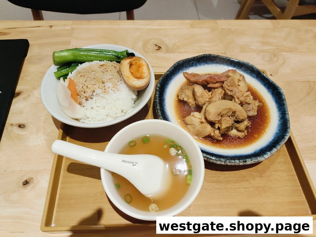 A delicious meal set featuring rice, braised meat, vegetables, a soy-marinated egg, and a clear soup.