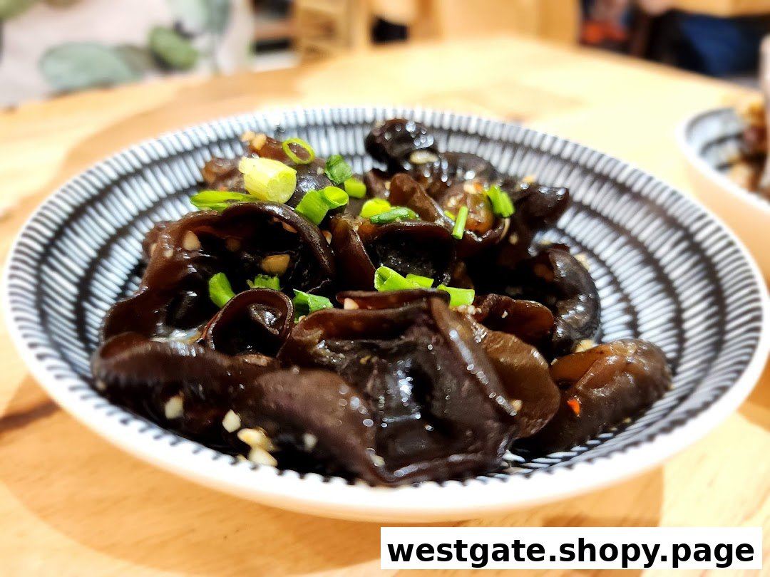A close-up of a bowl of seasoned black fungus (wood ear mushrooms) garnished with green onions.