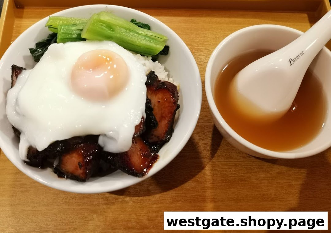 A delicious bowl of char siew rice with a fried egg and vegetables, served with a side of soup.
