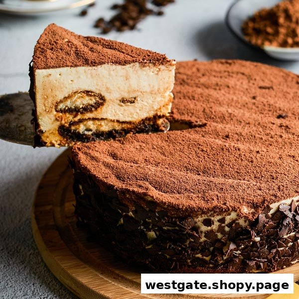 A delicious slice of tiramisu-style cake being served from a whole cake.