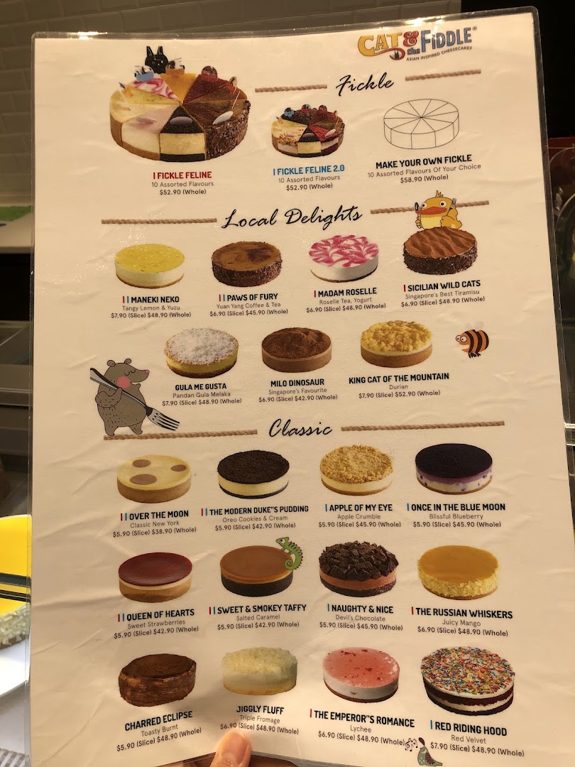 A detailed menu displaying various cheesecakes with prices and descriptions from Cat & the Fiddle.