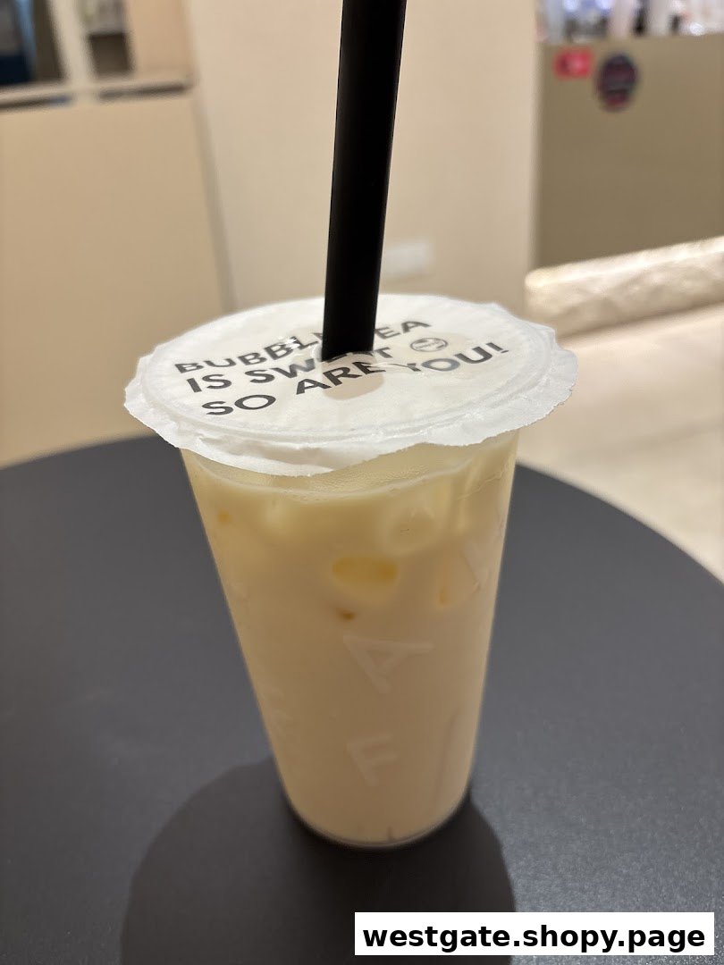 A close-up of a creamy bubble tea from Chaffic Westgate with a playful message on the lid.
