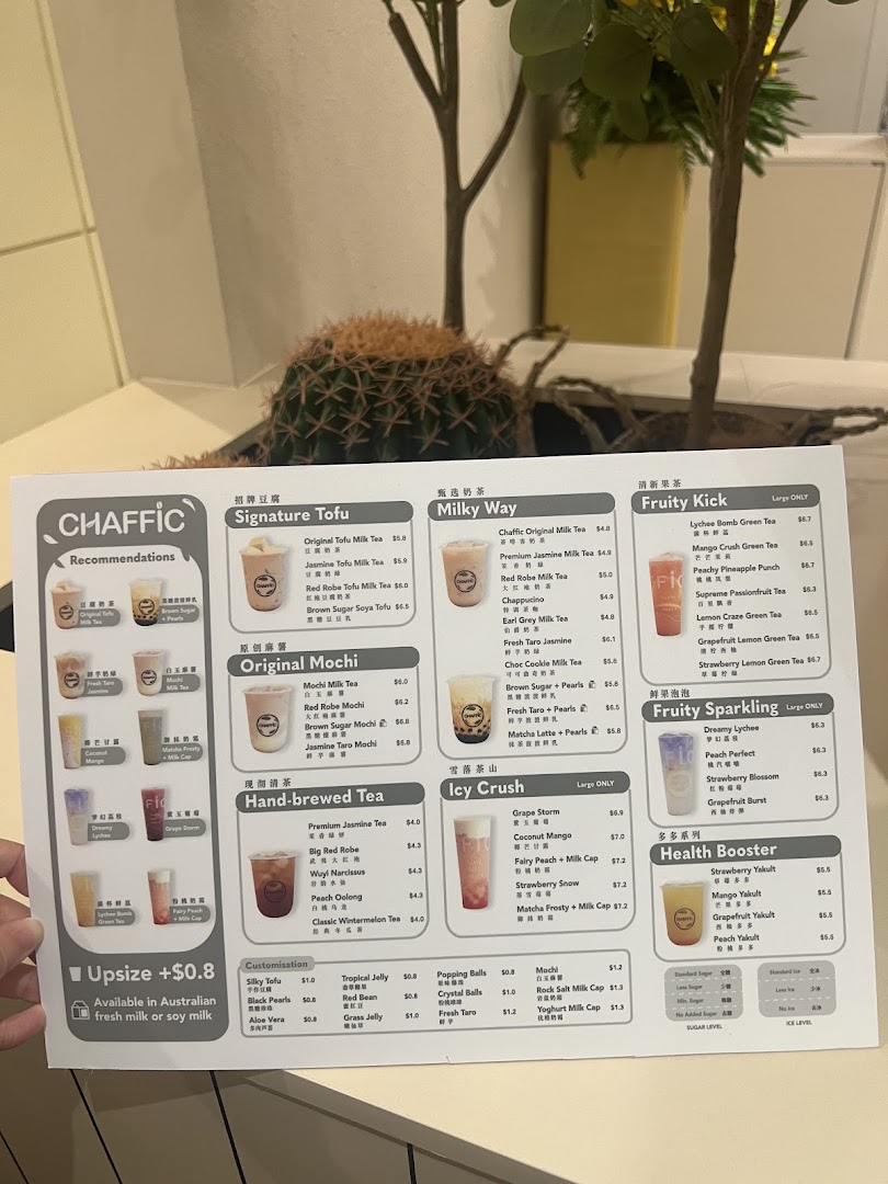 A hand holds up a detailed menu for Chaffic Westgate, showcasing various bubble tea and drink options.