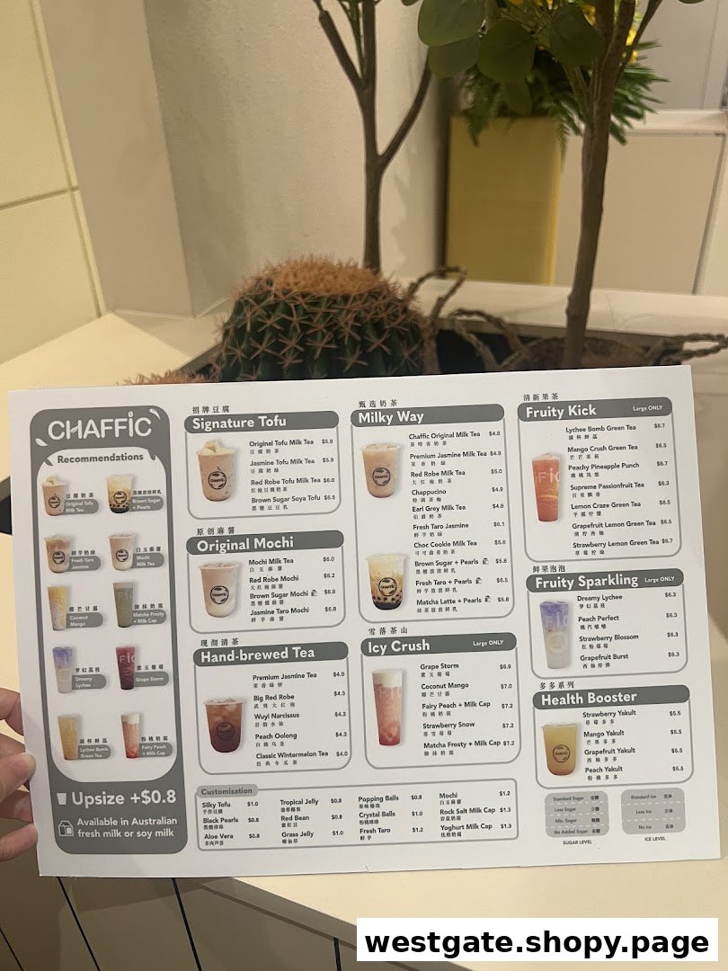 A hand holds up a detailed menu for Chaffic Westgate, showcasing various bubble tea and drink options.