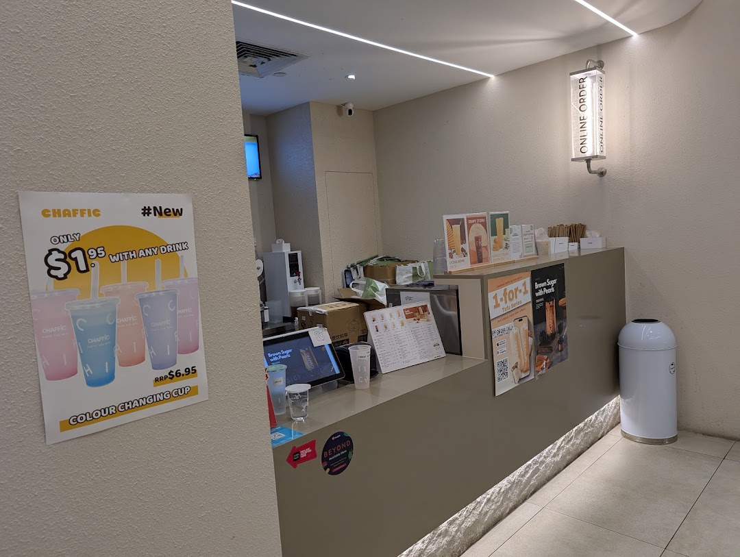 A view of Chaffic's modern counter area, featuring promotional displays and a clean design.