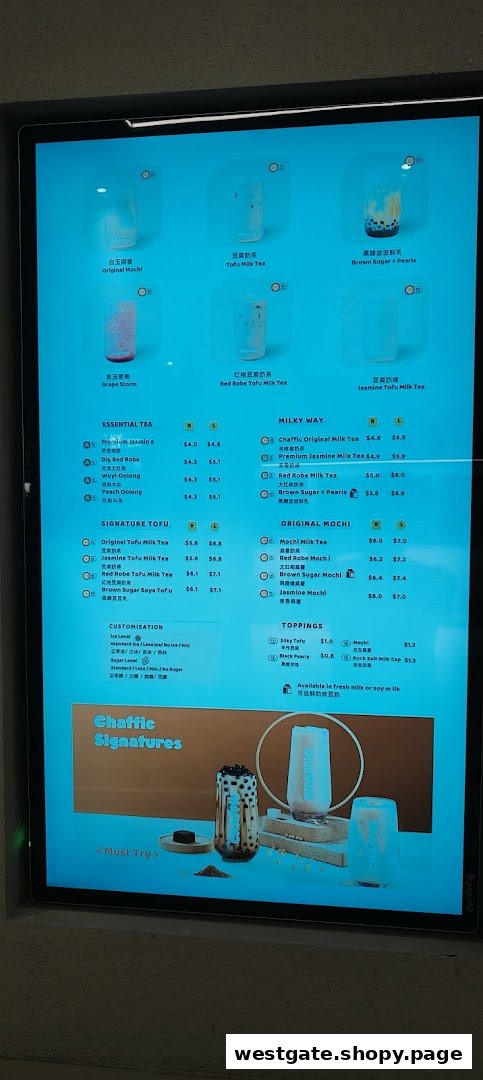 A digital menu board displaying various bubble tea and tofu milk tea options at Chaffic Westgate.