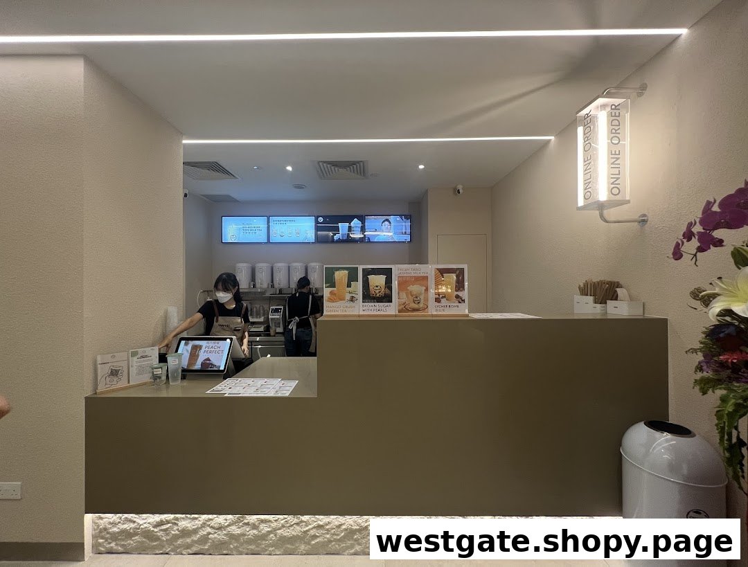 A staff member serves customers at the modern counter of Chaffic Westgate, showcasing their beverage offerings.