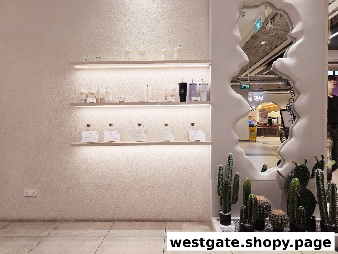 A modern retail display featuring minimalist products, decorative cacti, and a unique mirror reflecting the mall.