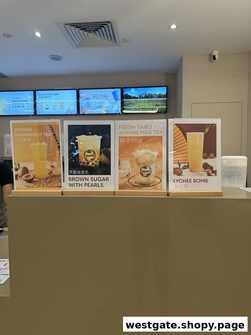 Chaffic counter displaying promotional posters for various refreshing bubble tea and specialty drinks.