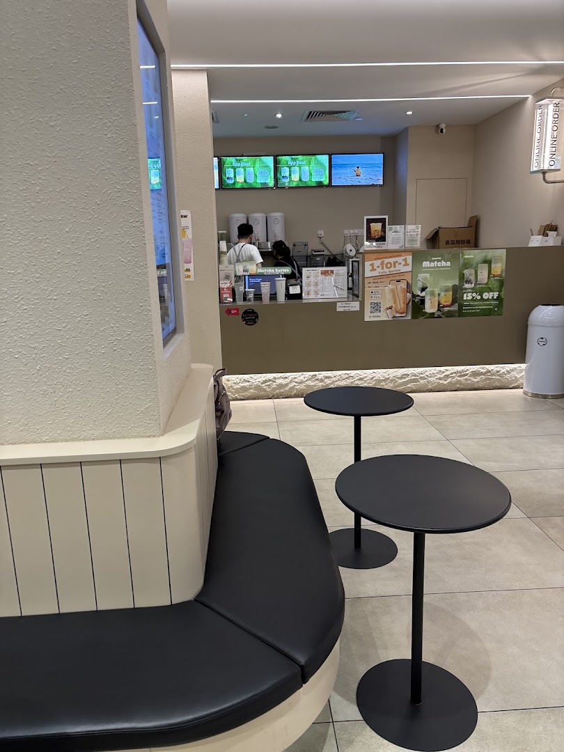 Interior view of Chaffic Westgate, showing the service counter, staff, and a cozy seating area.