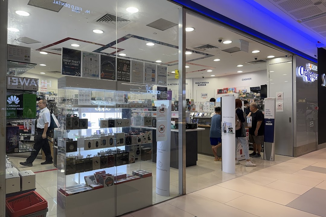 The image captures the inviting glass entrance of Challenger Mobile, showcasing various electronics and customers browsing inside.