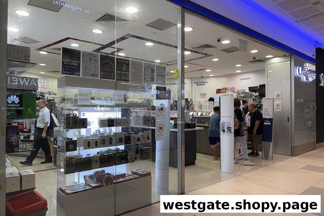 The image captures the inviting glass entrance of Challenger Mobile, showcasing various electronics and customers browsing inside.
