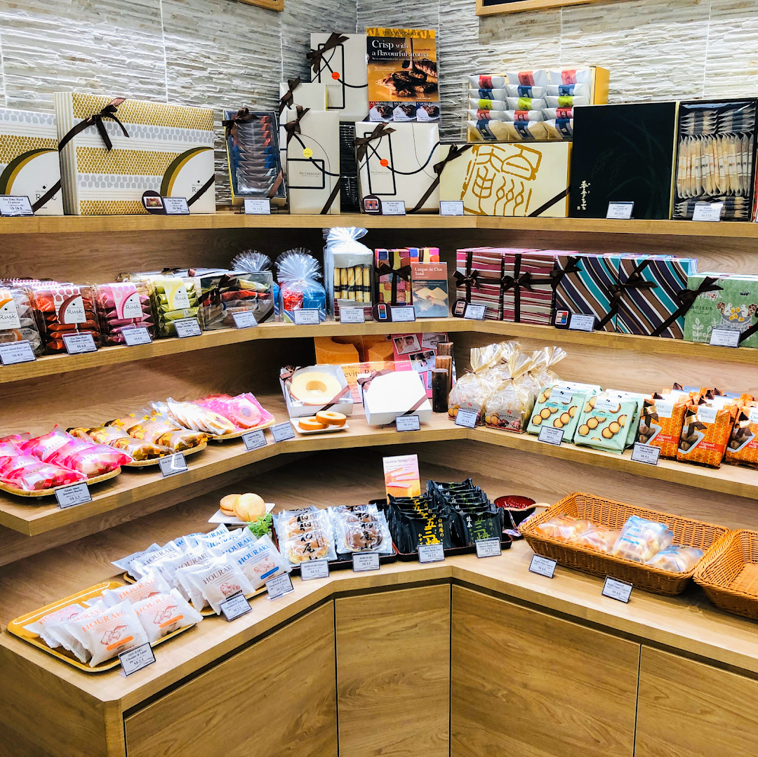 A vibrant display of beautifully packaged Japanese confectionery, pastries, and gift sets at Châteraisé.