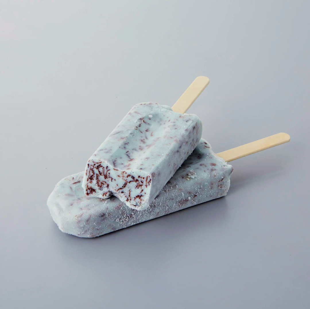 Two refreshing ice cream bars, one with a bite, showcasing a delightful frozen treat from Châteraisé.