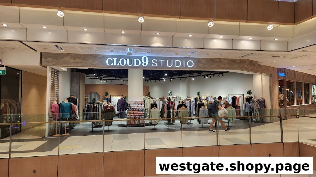 The image shows the brightly lit entrance of Cloud 9 Studio, a clothing store, with racks of apparel visible.