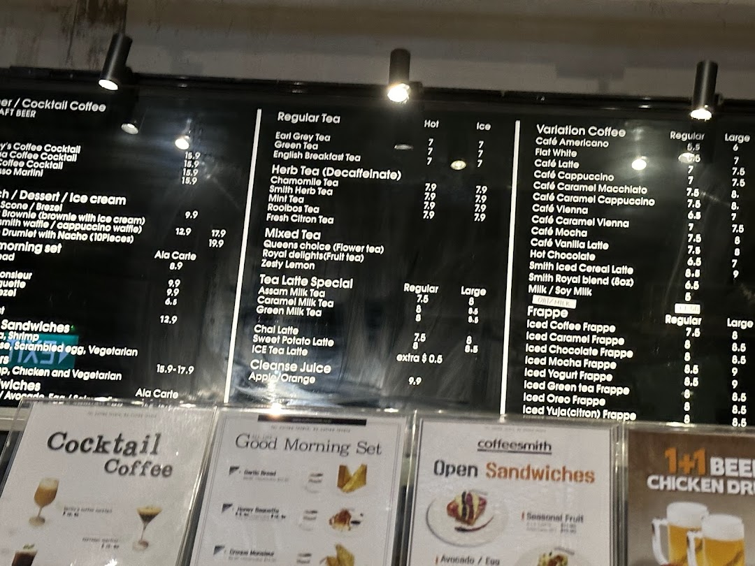 A detailed view of Coffeesmith's extensive menu board, showcasing various coffee, tea, and food options with prices.