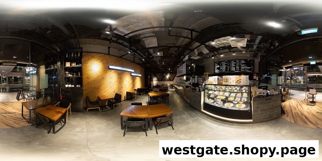 A panoramic view of Coffeesmith's modern and spacious interior, featuring seating areas, counter, and display cases.
