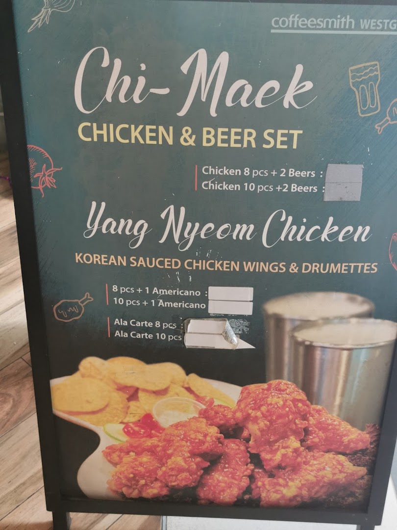 A menu board displaying Korean fried chicken and beer sets from Coffeesmith.