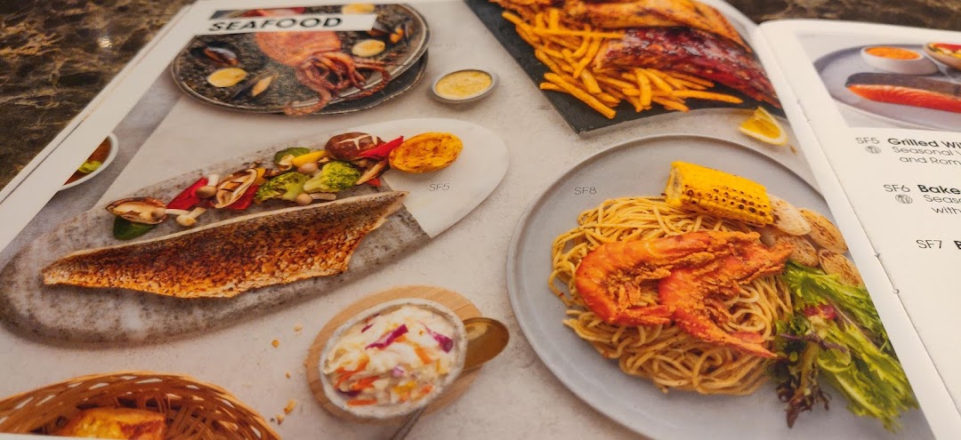 A close-up view of a menu page displaying various seafood dishes.