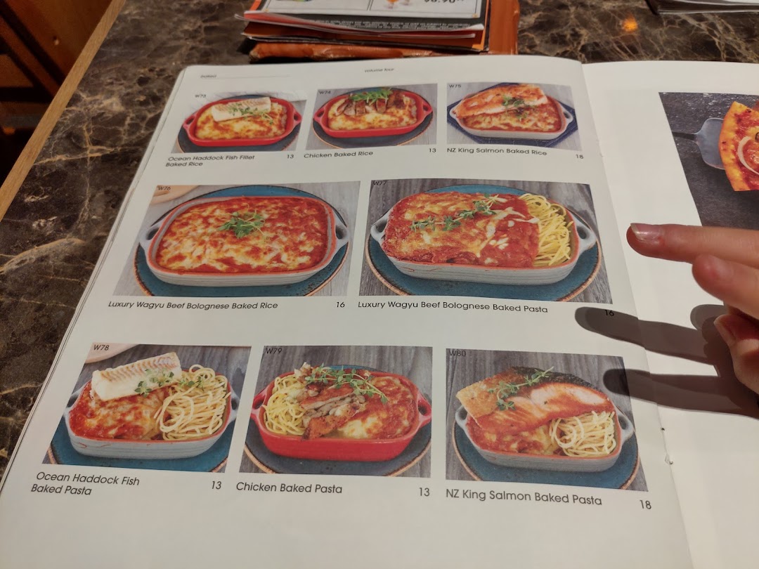 A menu page from COLLINS Westgate showcasing various baked rice and pasta dishes with prices.