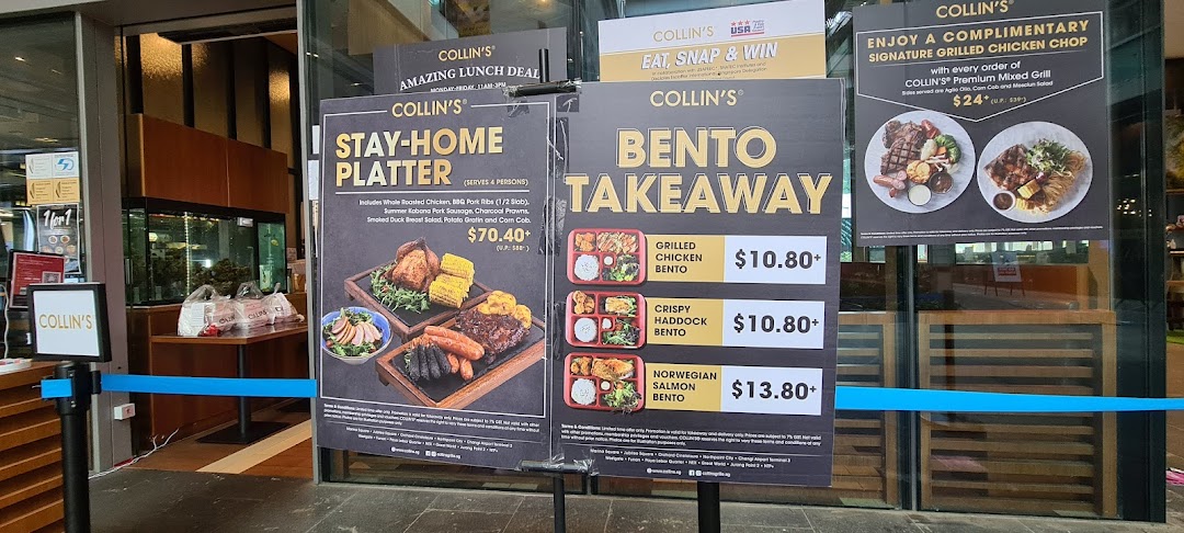 Promotional posters at COLLINS Westgate entrance featuring takeaway bentos, platters, and grill offers.
