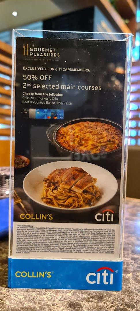 A promotional stand at COLLIN'S restaurant featuring a Citi cardmember dining offer.