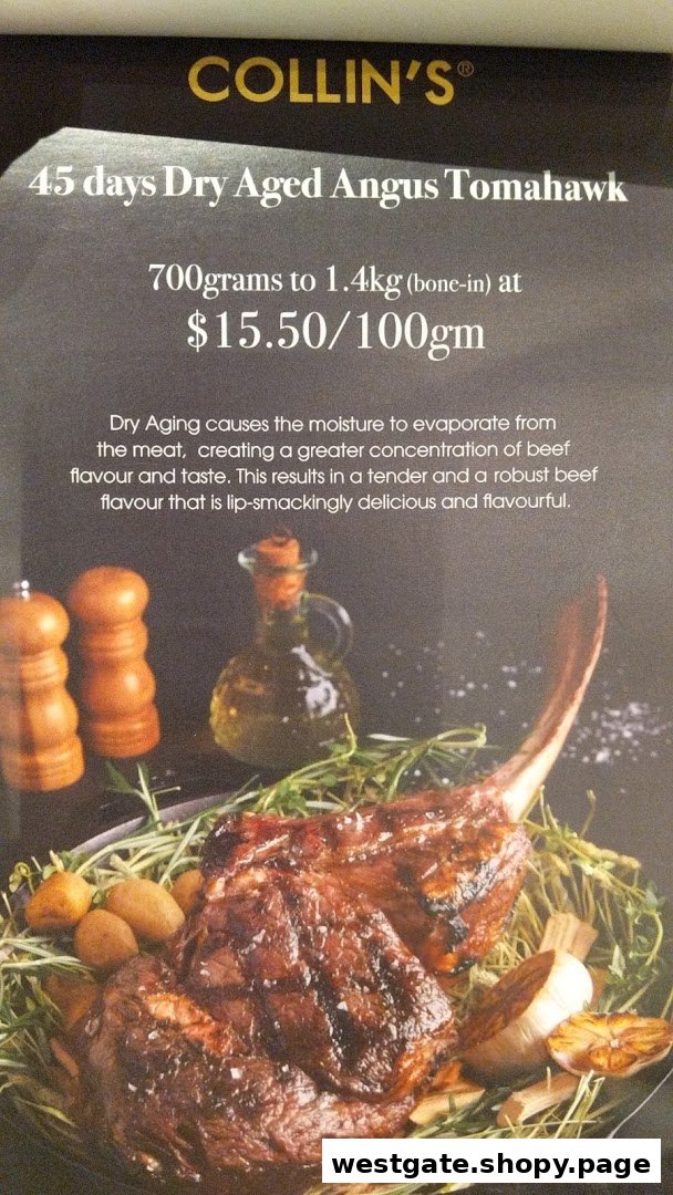 A promotional display for COLLIN'S featuring a 45-day Dry Aged Angus Tomahawk steak.