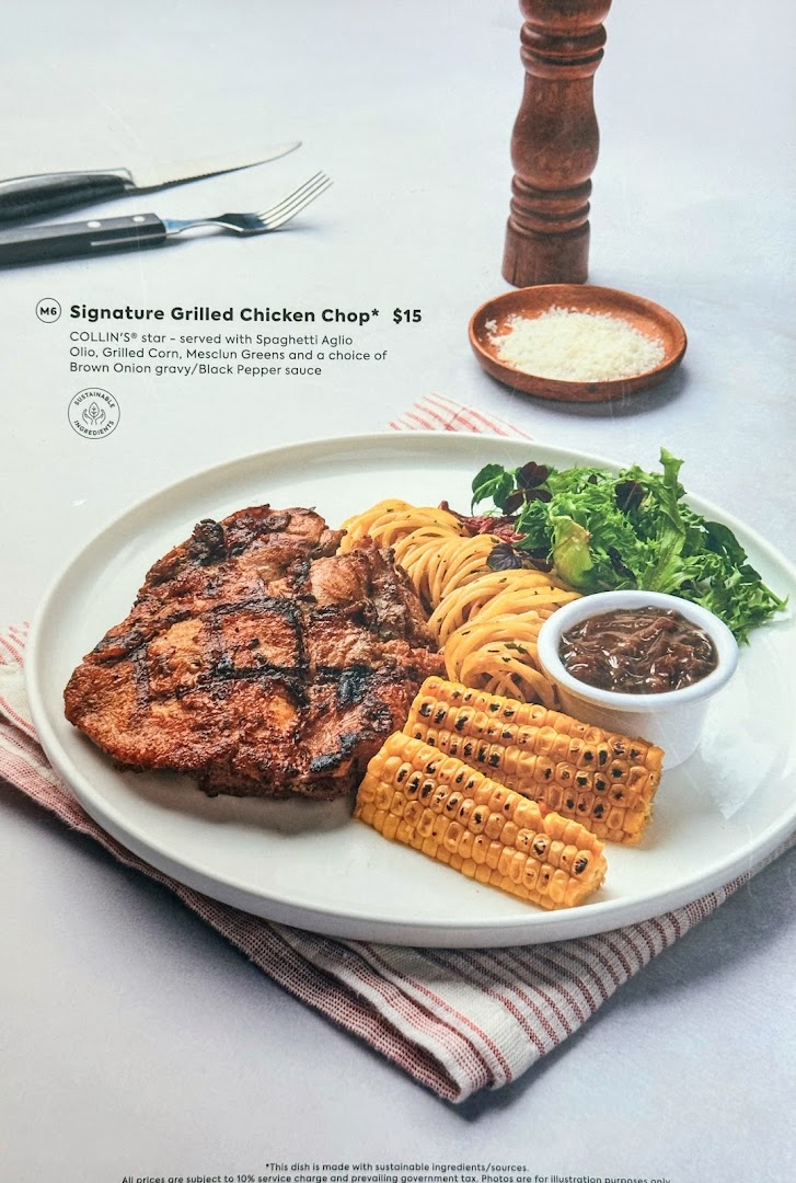 A delicious Signature Grilled Chicken Chop dish with spaghetti, corn, and greens.
