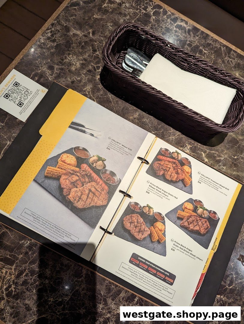 An open menu at COLLINS Westgate showcasing various grilled meats and steak options.
