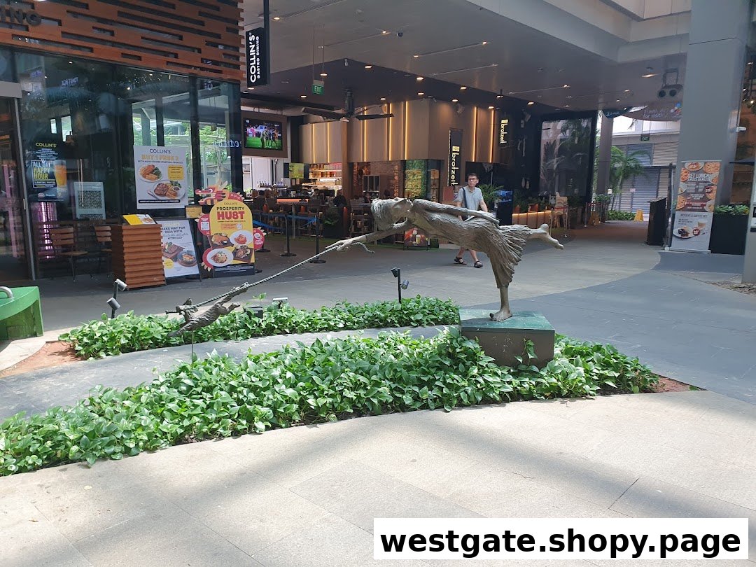 The inviting entrance of COLLINS Westgate restaurant, featuring outdoor seating, promotional displays, and a unique statue.