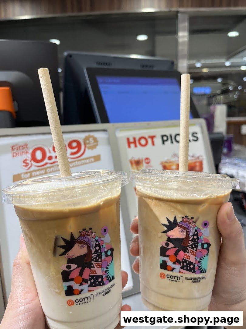 Two hands hold two iced coffee drinks from Cotti Coffee, featuring unique 'Suspensegirl' cup designs.