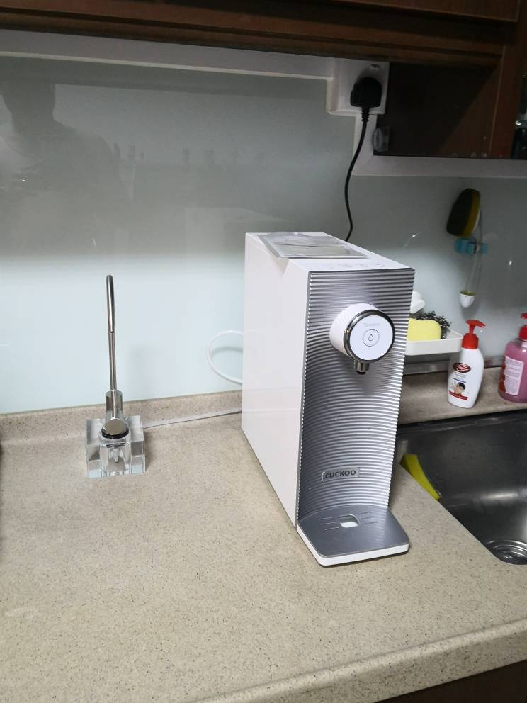 A CUCKOO water purifier displayed on a kitchen counter.