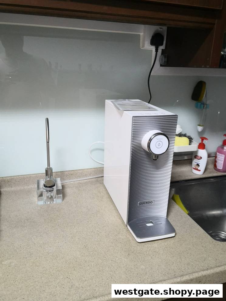 A CUCKOO water purifier displayed on a kitchen counter.